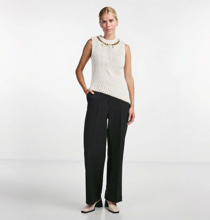 Asymmetrical Chain Knit Tank Top – Slim Fit worn with wide-leg trousers, showcasing modern street fashion style.