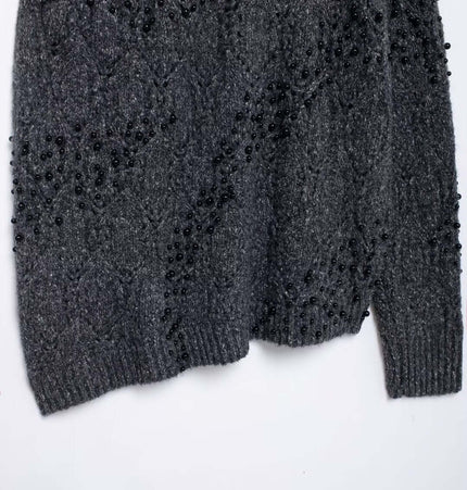 Asymmetrical Off-Shoulder Knit Sweater with bead decoration in dark gray, showcasing a stylish and elegant design.
