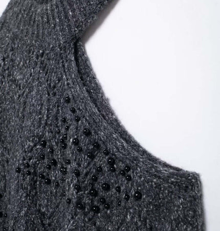 Asymmetrical Off-Shoulder Knit Sweater featuring a half turtleneck and hollow bead decoration in a chic design.