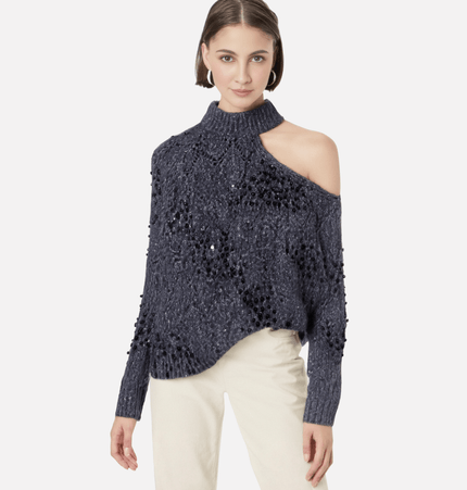 Asymmetrical Off-Shoulder Knit Sweater showcased by a model, featuring a stylish shoulder opening and hollow bead decoration.