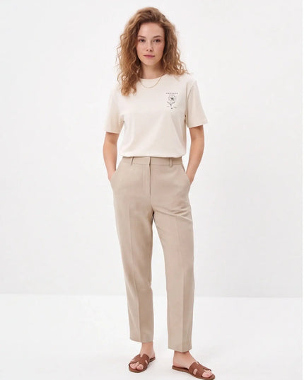 Tailored Monochrome Tee Vintage White — lifestyle detail of the mid-weight fabric in natural movement