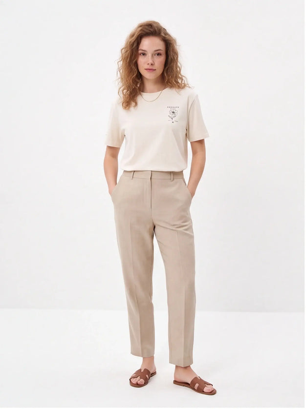 Tailored Monochrome Tee Vintage White — lifestyle detail of the mid-weight fabric in natural movement