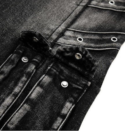 Close-up of the Belted Distressed Cargo Jeans showcasing heavy-duty snap buttons and textured black denim fabric.