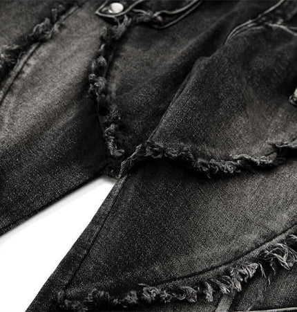 Belted Distressed Cargo Jeans close-up showcasing raw hem detailing and faded black denim texture.