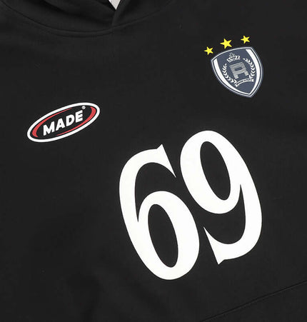 Detail of Oversized Hooded Sweatshirt – Loose Fit with logo and number 69 on black fabric.