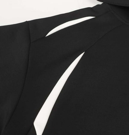 Patchwork Embroidered Hoodie – Loose Fit featuring a black design with white accents and a classic hooded collar.