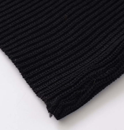 Close-up of the fabric texture of the Round Neck Flower Knit Top – Sleeveless in smooth black knit.