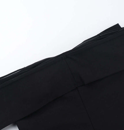 Close-up of the Slim Fit One-Shoulder Bow Top in black showcasing its elegant design and soft fabric.