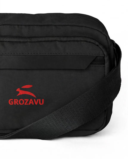 Zipped outer pocket and rain flap detail on the utility crossbody