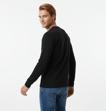 Man showcasing the Bottom Knit Long Sleeve Pullover in black, turned slightly to highlight its stylish design.