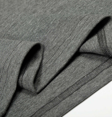 Close-up of the fabric of the Bottom Knit Long Sleeve Pullover in medium gray, highlighting its softness and stitching.