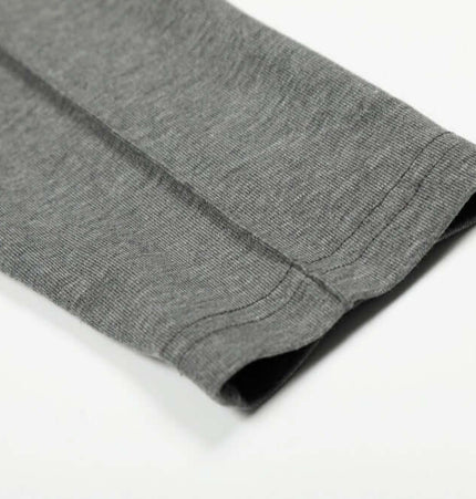 Bottom Knit Long Sleeve Pullover close-up showing gray sleeve detail on a soft viscose blend fabric.
