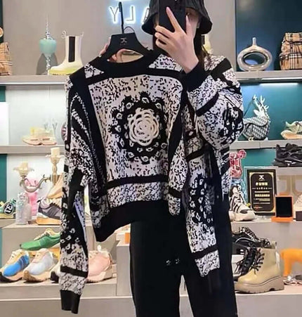 Camellia Jacquard Beaded Knit Sweater displayed on a model in a trendy retail environment.