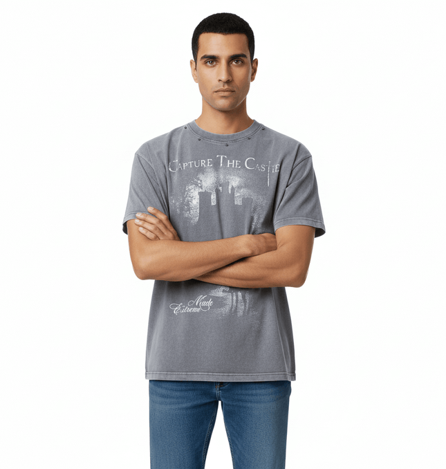 Printed Short Sleeve TShirt – Loose Fit worn by a man with a graphic design on a gray background.