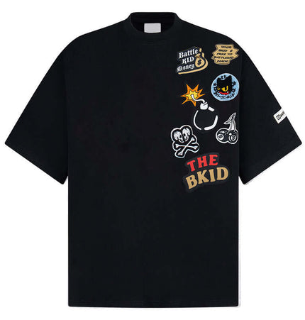 Cartoon Badge Cotton TShirt – Loose Fit featuring playful graphics and a relaxed oversized design.