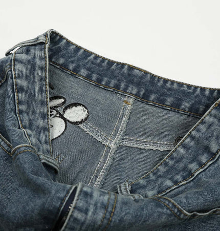 Casual Embroidered Denim Cropped Pants close-up showing detail of waistband and embroidery.