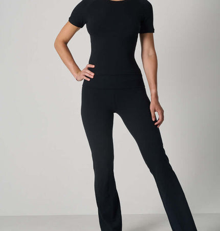 Casual Fit Cotton Jersey Yoga Set featuring a short sleeve crop top and high-waist long flare pants in black.