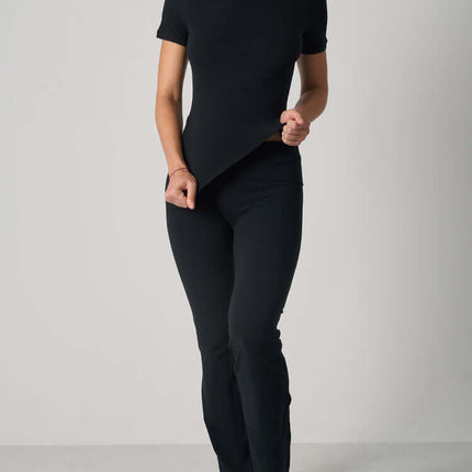 Casual Fit Cotton Jersey Yoga Set featuring a stylish black crop top and high-waist flare pants.