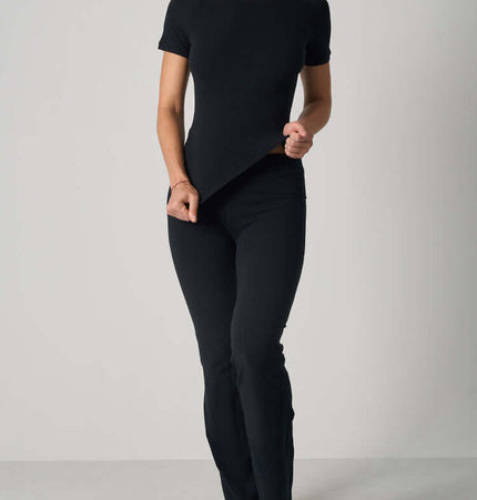 Casual Fit Cotton Jersey Yoga Set featuring a stylish black crop top and high-waist flare pants.