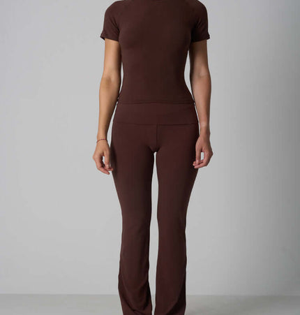 A model wearing a Casual Fit Cotton Jersey Yoga Set in brown, showcasing the stylish and comfortable design.