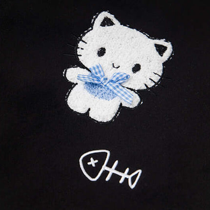 Cat Embroidered Baseball Jacket - Loose Fit featuring a cute cartoon cat with a blue bow on dark fabric.