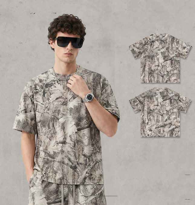Camouflage Drop-Shoulder TShirt – Loose Fit worn by a model featuring a bold branch camouflage pattern.