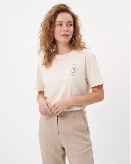 Tailored Monochrome Tee Vintage White — three-quarter lifestyle angle highlighting the clean double-needle sleeve hem