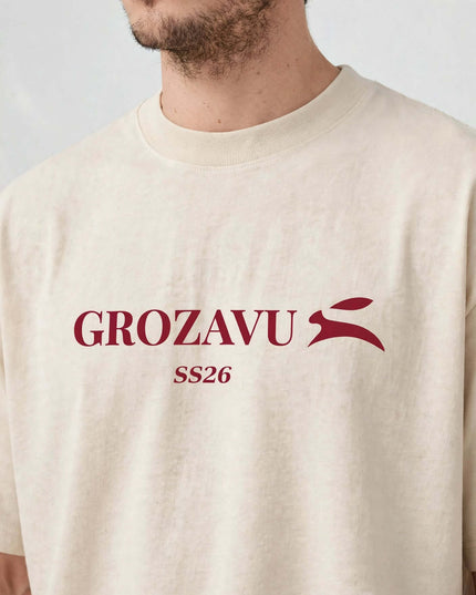 Close-up of the chest graphic on the beige heavyweight tee