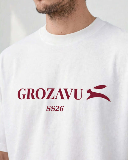 Close-up of the burgundy chest print on the white heavyweight tee