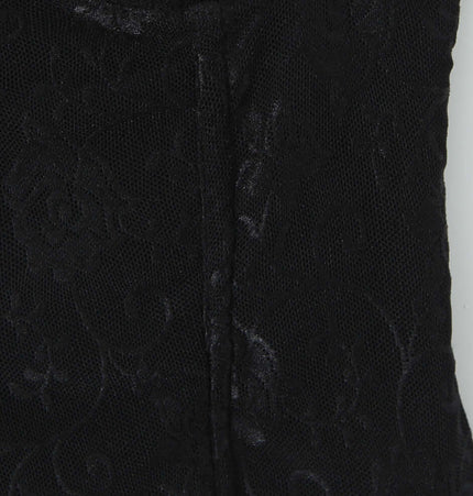 Close-up of the fabric texture on the Cinched Lace Fishbone Tank Top, showcasing the intricate lace pattern.