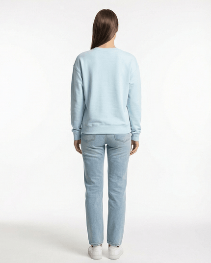 Rear view of the Maison Grozavu Sleek Bone Tee in tee — showing the effortless drape.