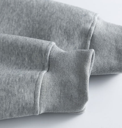 Cotton Loose Fit Hoodie Sweatshirt close-up of the sleeves and cuffs showing soft gray cotton fabric.