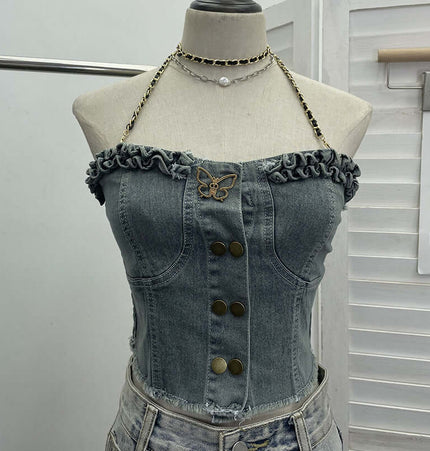 Denim Buckle Strapless Slim Fit Tank Top featuring butterfly detailing and ruffled edges on a dress form.