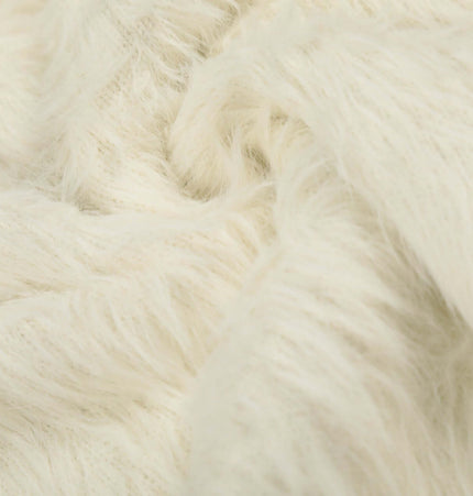 Close-up of soft white fabric texture, showcasing the cozy material used in the Fleece Letter Pullover Sweater – Loose Fit.