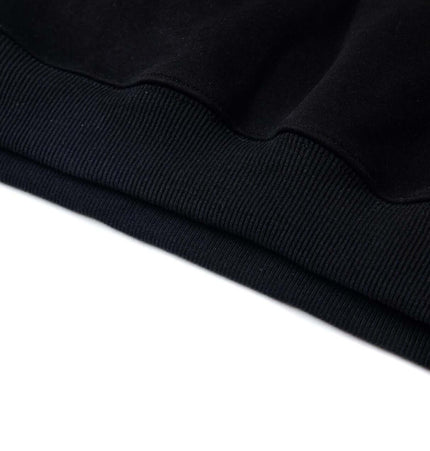 Close-up of the hem detail on the Cross Embroidered Hoodie – Loose Fit, showcasing its quality and design features.
