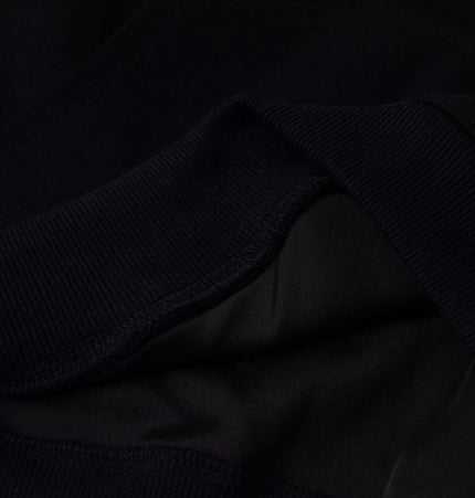 Close-up of the fabric and neckline of the Cross Embroidered Hoodie – Loose Fit showcasing its quality and texture.