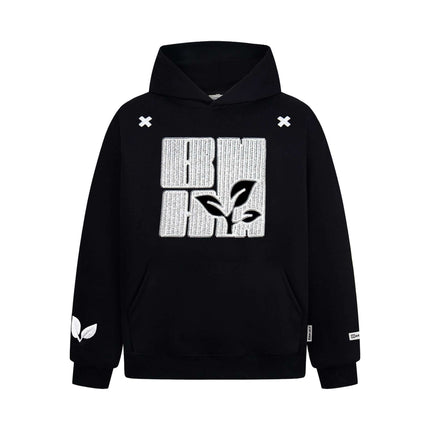 Cross Embroidered Hoodie – Loose Fit with leaf design and cross embroidery detail in black.