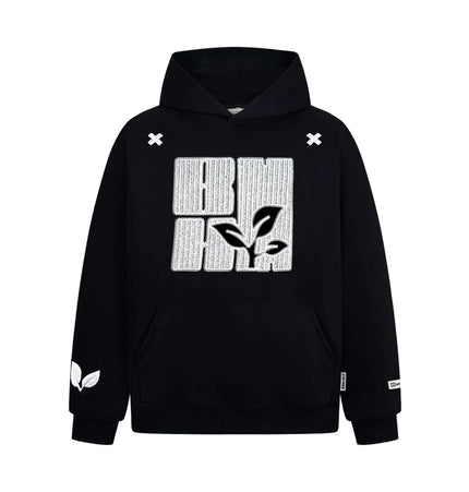 Cross Embroidered Hoodie – Loose Fit with leaf design and cross embroidery detail in black.