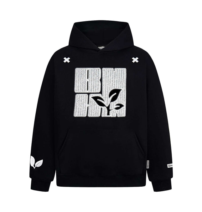 Cross Embroidered Hoodie – Loose Fit with leaf design and cross embroidery detail in black.