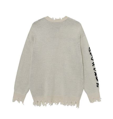Back view of the Cross Jacquard Knit Sweater – Loose Fit with frayed edges and textured knit fabric.