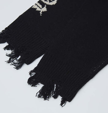 Cross Jacquard Knit Sweater – Loose Fit sleeves showing fringe detail and jacquard pattern.