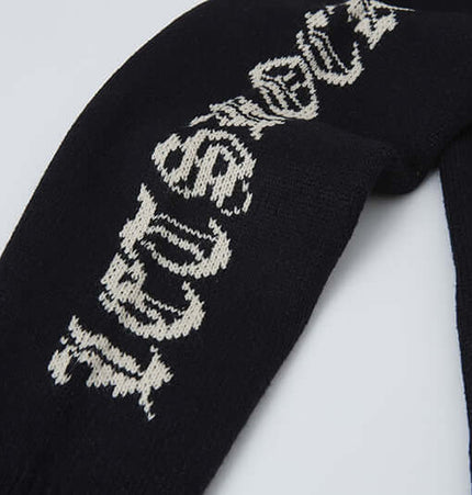 Cross Jacquard Knit Sweater – Loose Fit showing detailed jacquard design on dark fabric.