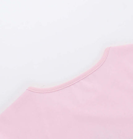 Back view of the Grozavu Cross Print Crop TShirt - Slim Fit in pink, highlighting its smooth fabric and neckline.