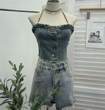 Denim Buckle Strapless Slim Fit Tank Top displayed on a mannequin with stylish buckle detailing and a layered ruffled neckline.