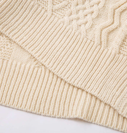 Close-up texture of the Diamond Pattern Jacquard Knit Sweater showcasing its intricate knit patterns and creamy color.