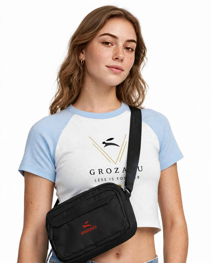 Low-angle editorial shot with the black utility crossbody bag