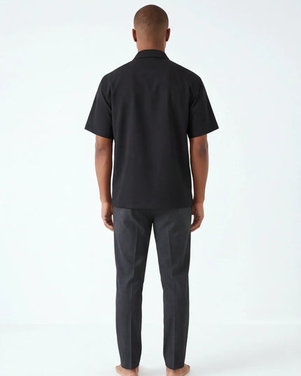 Rear view of the Maison Grozavu Chalk Shorts Series in shorts — showing the structural collar.