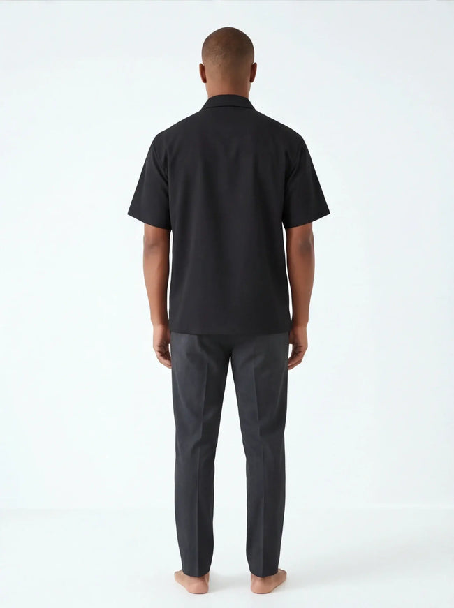Rear view of the Maison Grozavu Chalk Shorts Series in shorts — showing the structural collar.