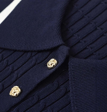 Eight-Strand Braided Knit Top – Loose Fit detail showing navy blue knitted texture and gold buttons.