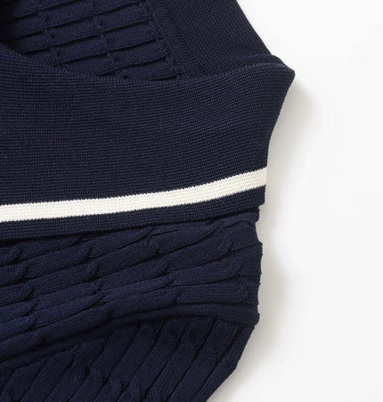 Close-up of the navy blue Eight-Strand Braided Knit Top – Loose Fit showcasing the textured knit design and ribbed detailing.